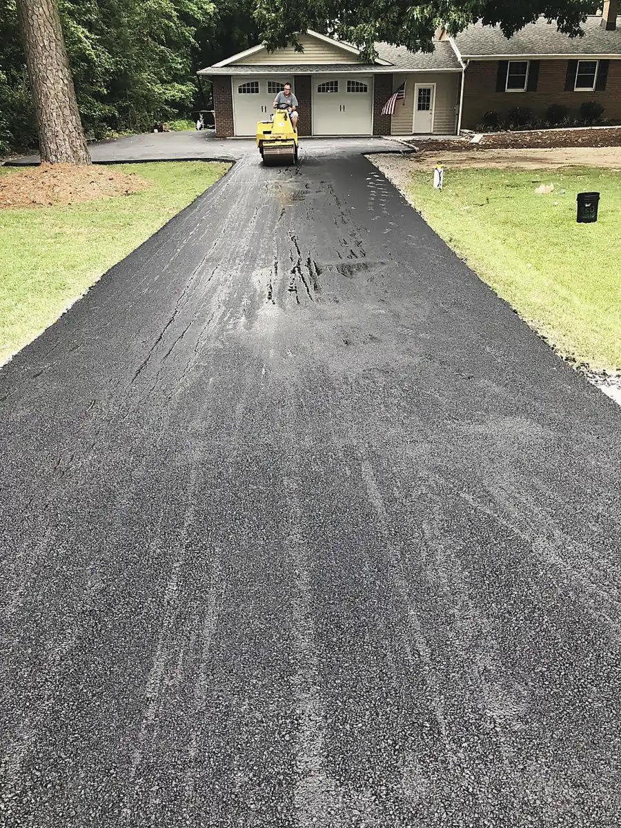 A roller compacting a new driveway